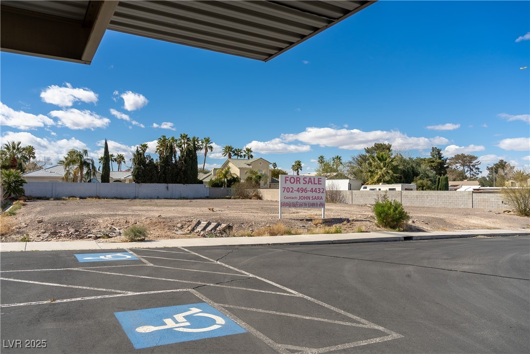 Harmon Las Vegas, NV 89121 - Photo 9 of 11 Uncovered parking lot featuring fence