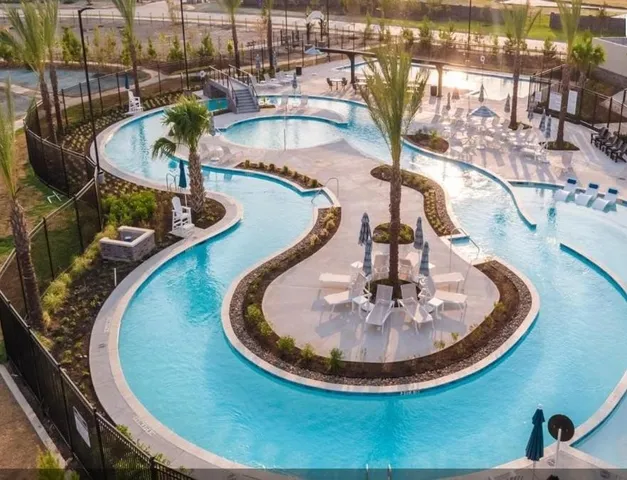 a view of a swimming pool with a fountain
