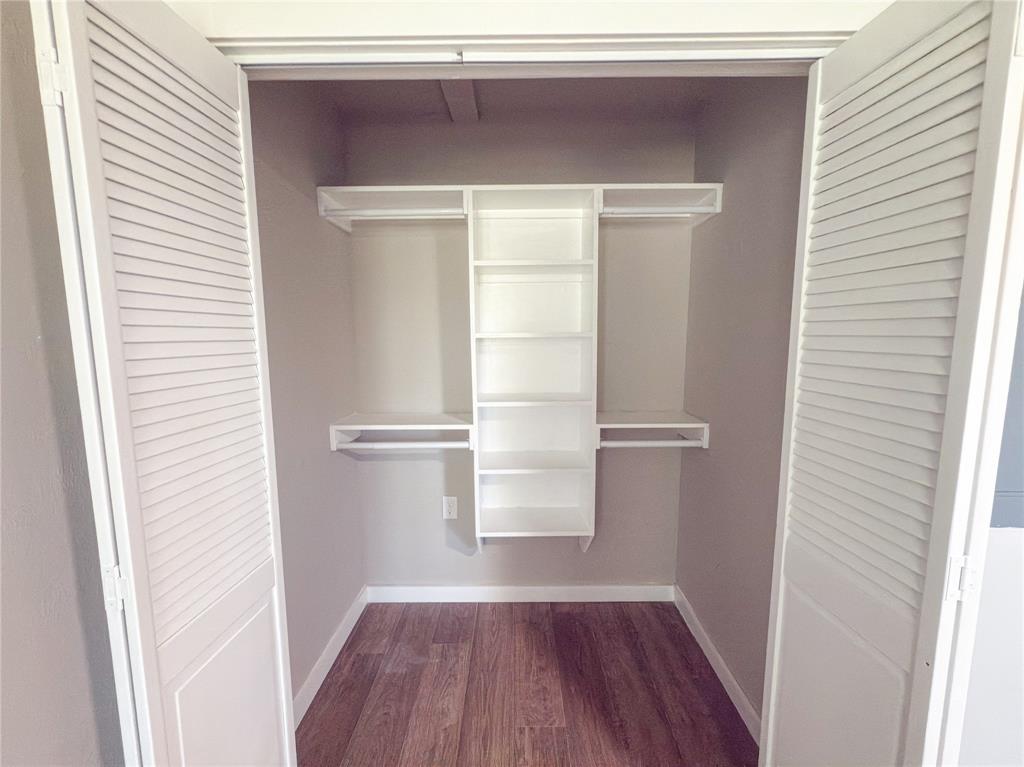 2431 Marfa Avenue Dallas, TX 75216 - Photo 31 of 39 a view of walk in closet with wooden floor