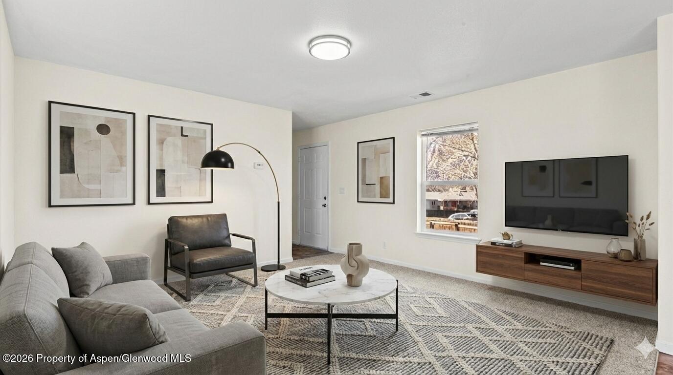 58 Logans Lane Parachute, CO 81635 - Photo 14 of 25 a living room with furniture and a flat screen tv
