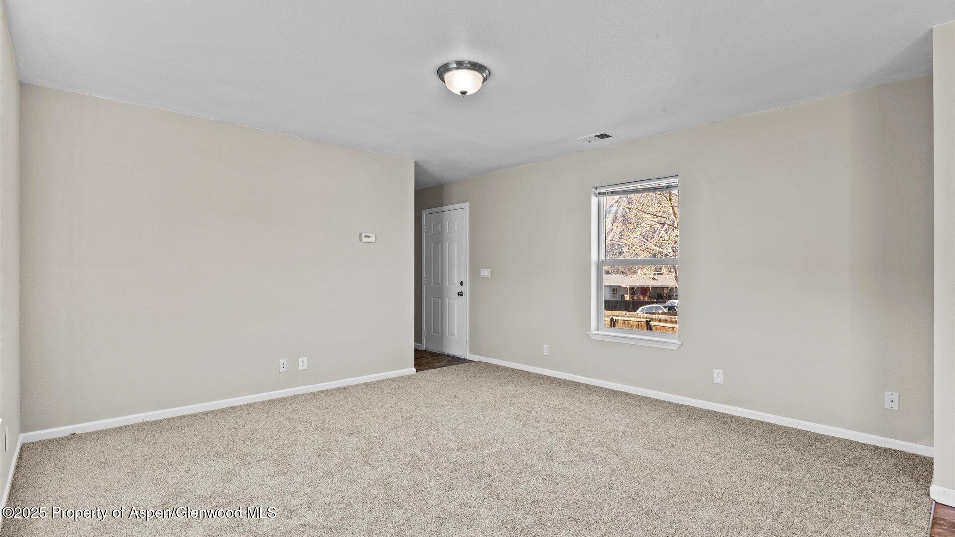58 Logans Lane Parachute, CO 81635 - Photo 15 of 25 an empty room with windows