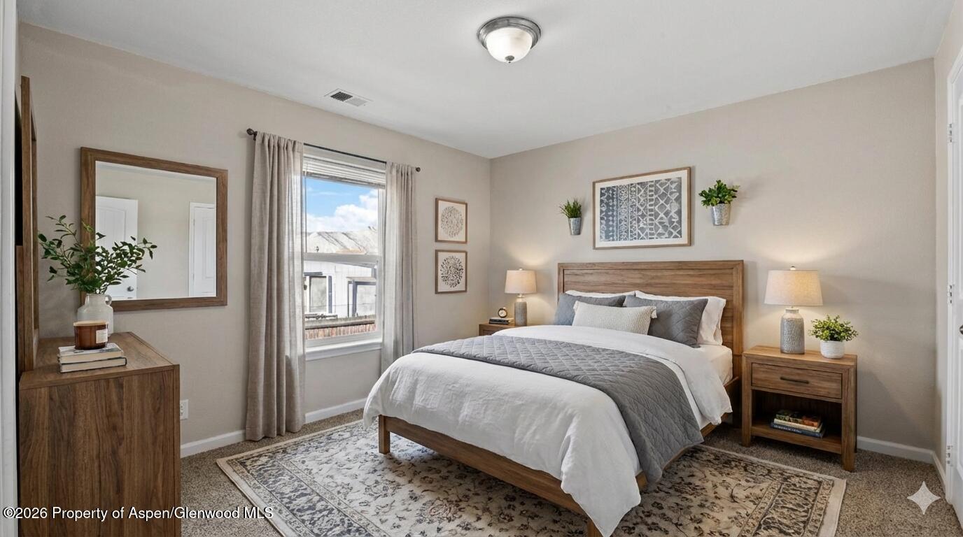 58 Logans Lane Parachute, CO 81635 - Photo 21 of 25 a bedroom with a bed and wooden floor