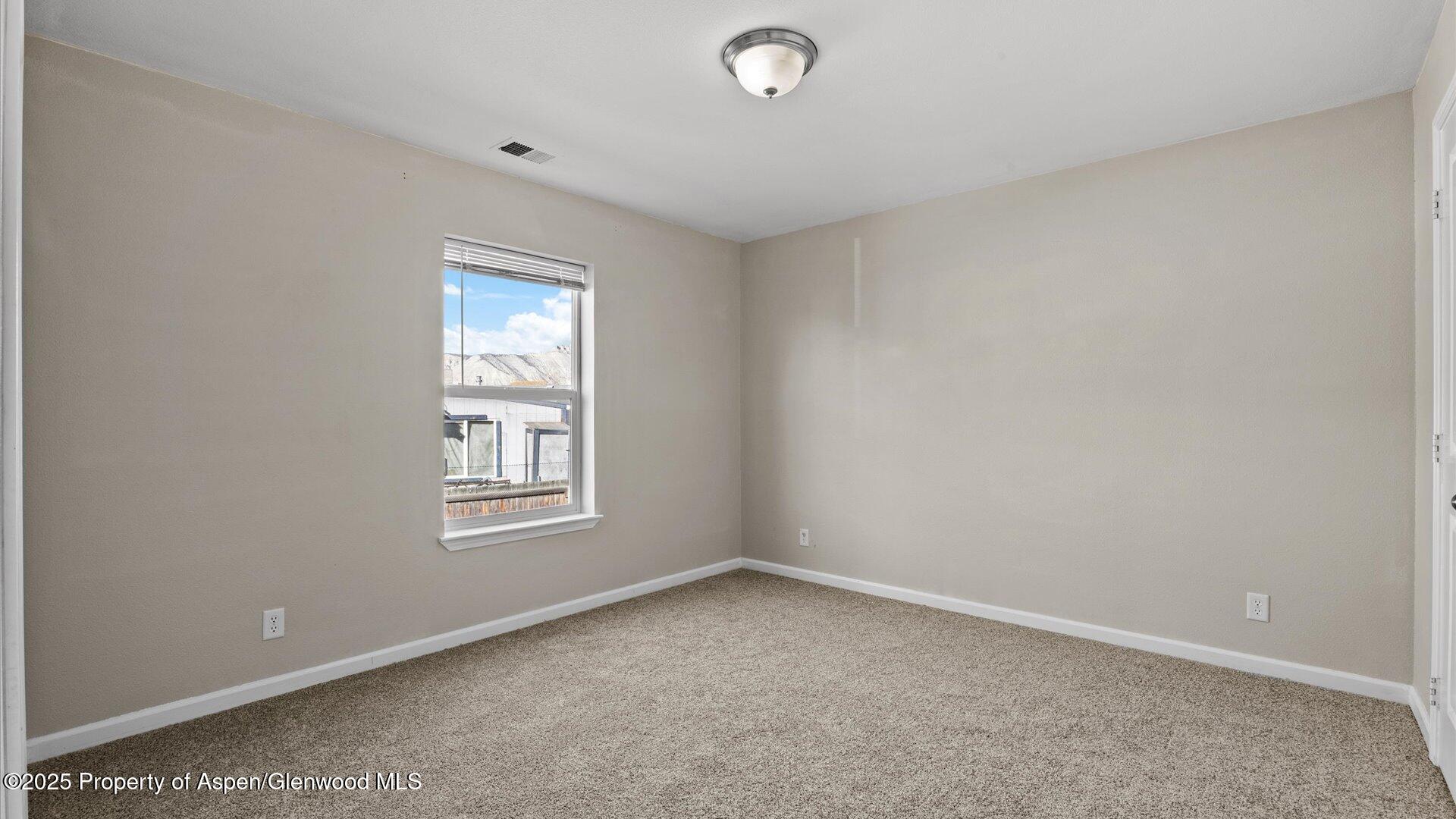 58 Logans Lane Parachute, CO 81635 - Photo 22 of 25 an empty room with windows