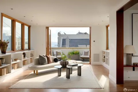 a view of living room with furniture and a window