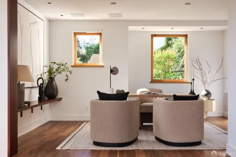 a view of a kitchen area with furniture and windows