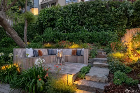a view of a chairs and table in the patio