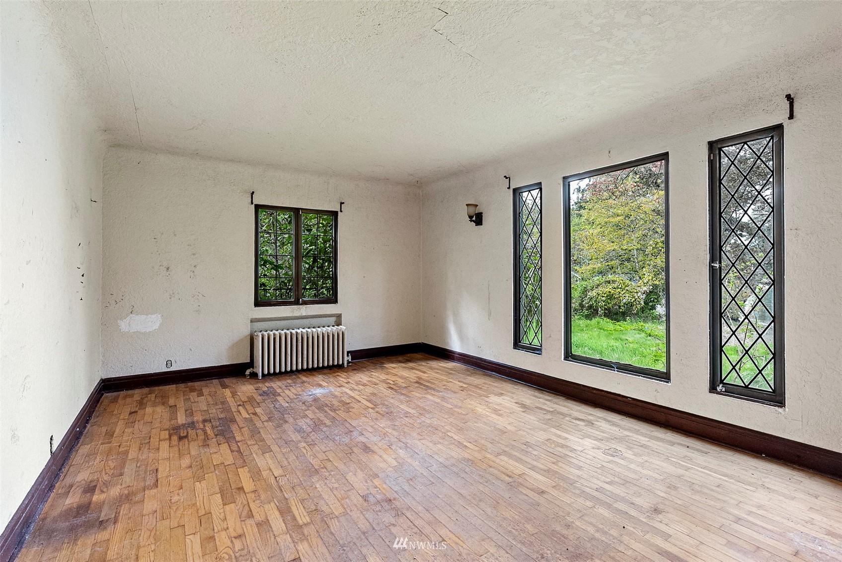 16601 Delano Road Southwest Lakebay, WA 98349 - Photo 14 of 31 a view of an empty room with wooden floor and a window