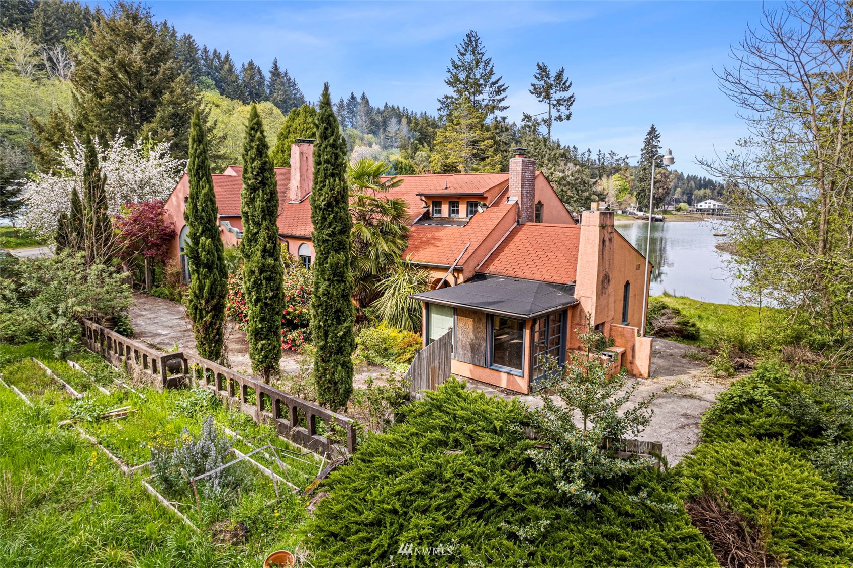16601 Delano Road Southwest Lakebay, WA 98349 - Photo 2 of 31 an aerial view of a house with a garden