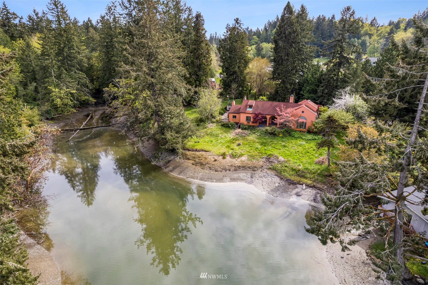 16601 Delano Road Southwest Lakebay, WA 98349 - Photo 3 of 31 a backyard of a house with a yard and outdoor seating