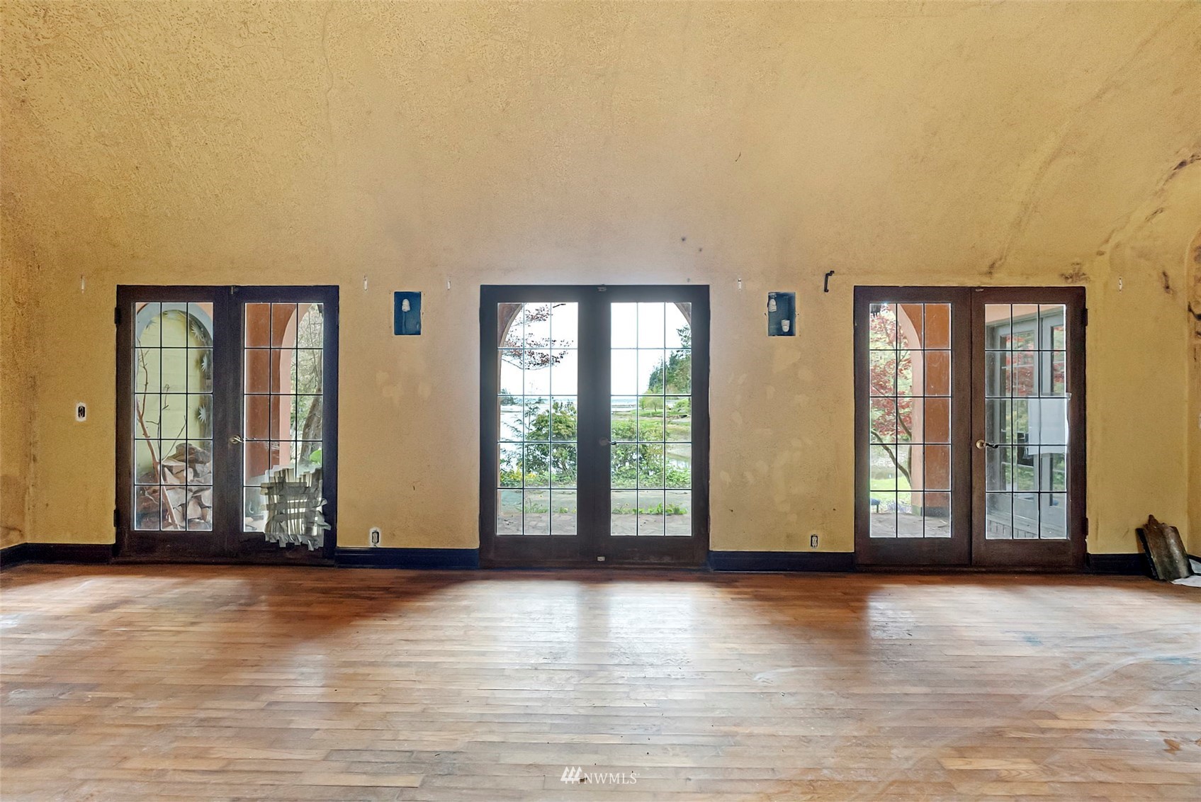 16601 Delano Road Southwest Lakebay, WA 98349 - Photo 8 of 31 a view of an empty room with wooden floor and a window