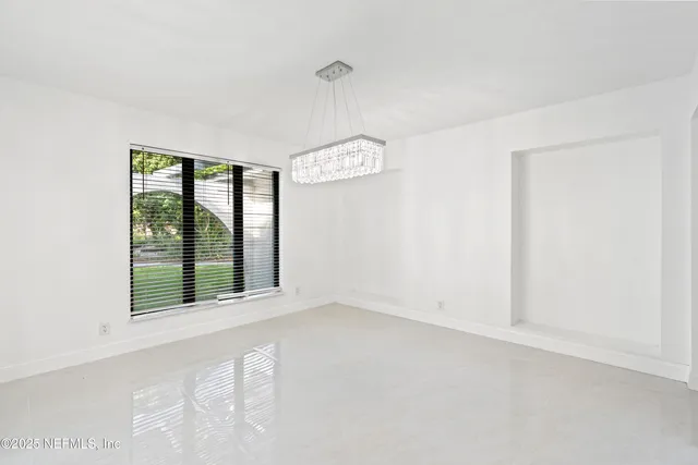 a kitchen with granite countertop a sink stainless steel appliances and cabinets