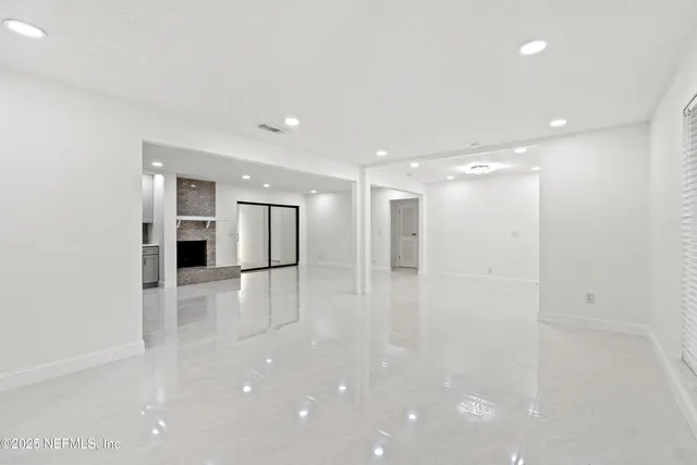 a bathroom with a sink a mirror and a lamp