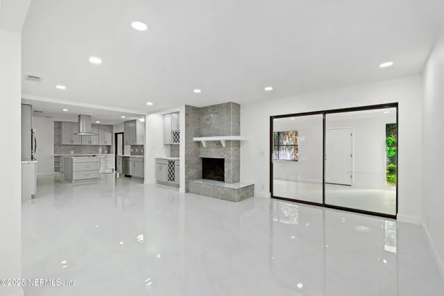 a view of house with a backyard