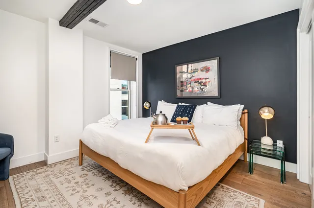 a bedroom with bed and a window