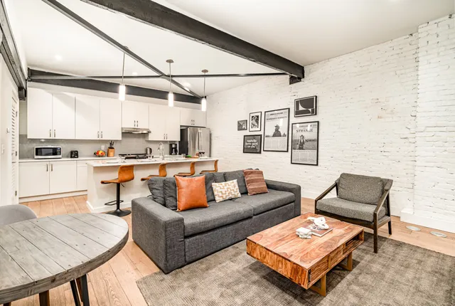 a living room with furniture and a table