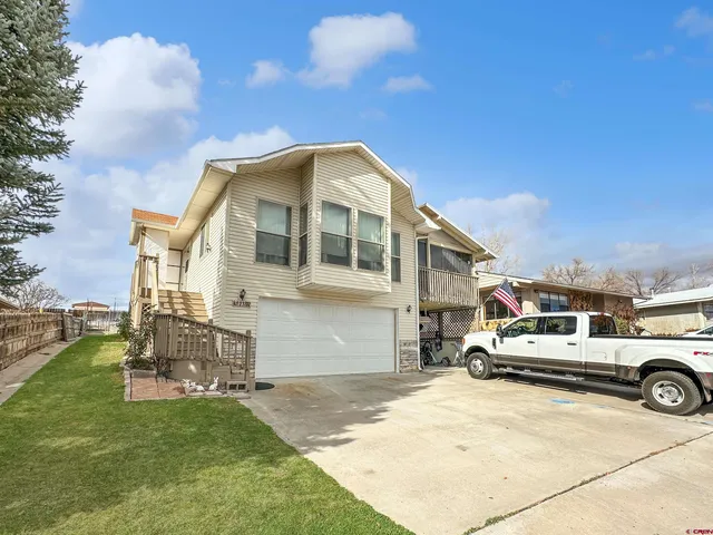 a view of a house with a sink and backyard