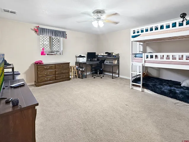 a bed room with furniture and a fireplace