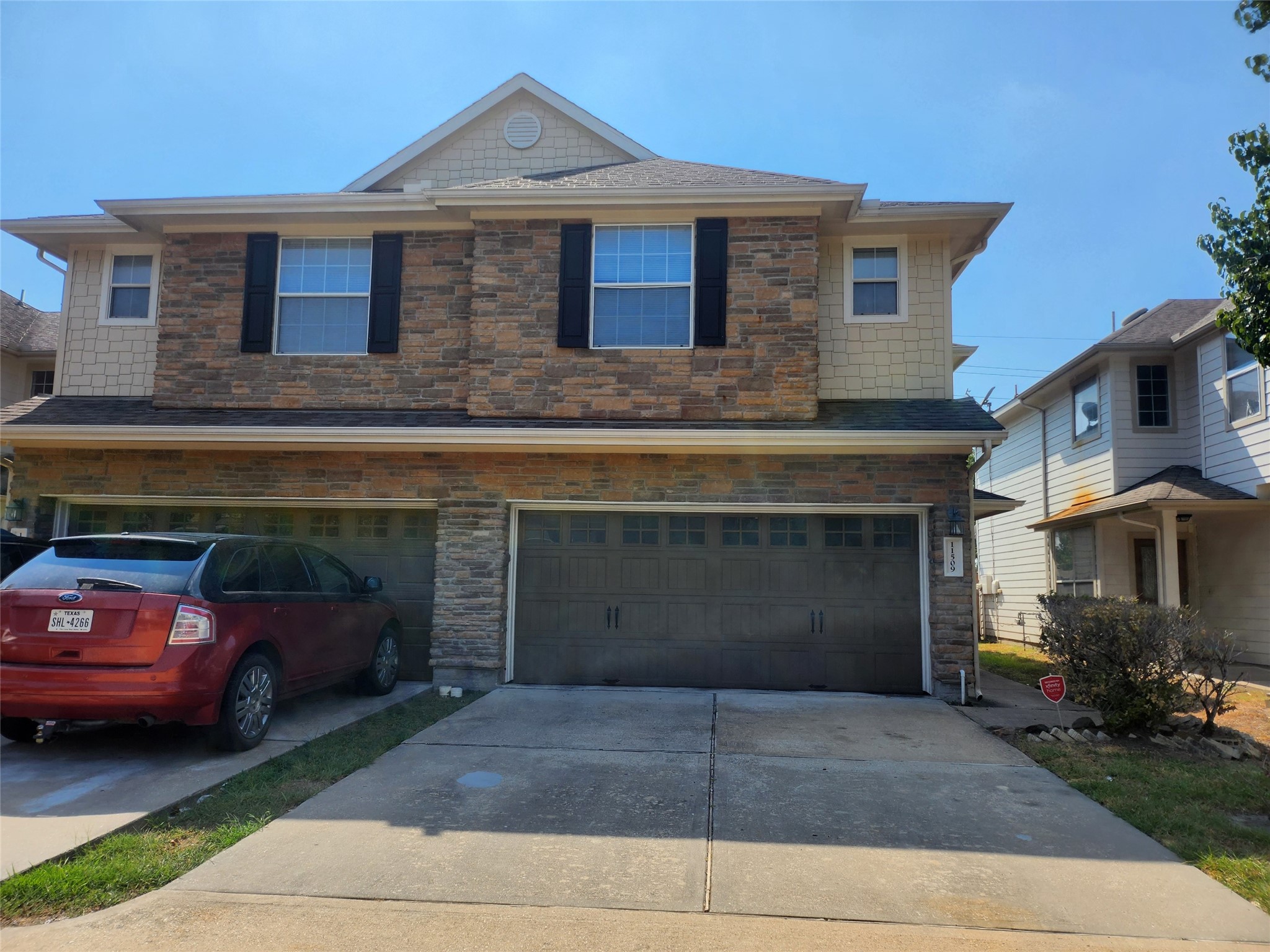 a front view of a house with parking space