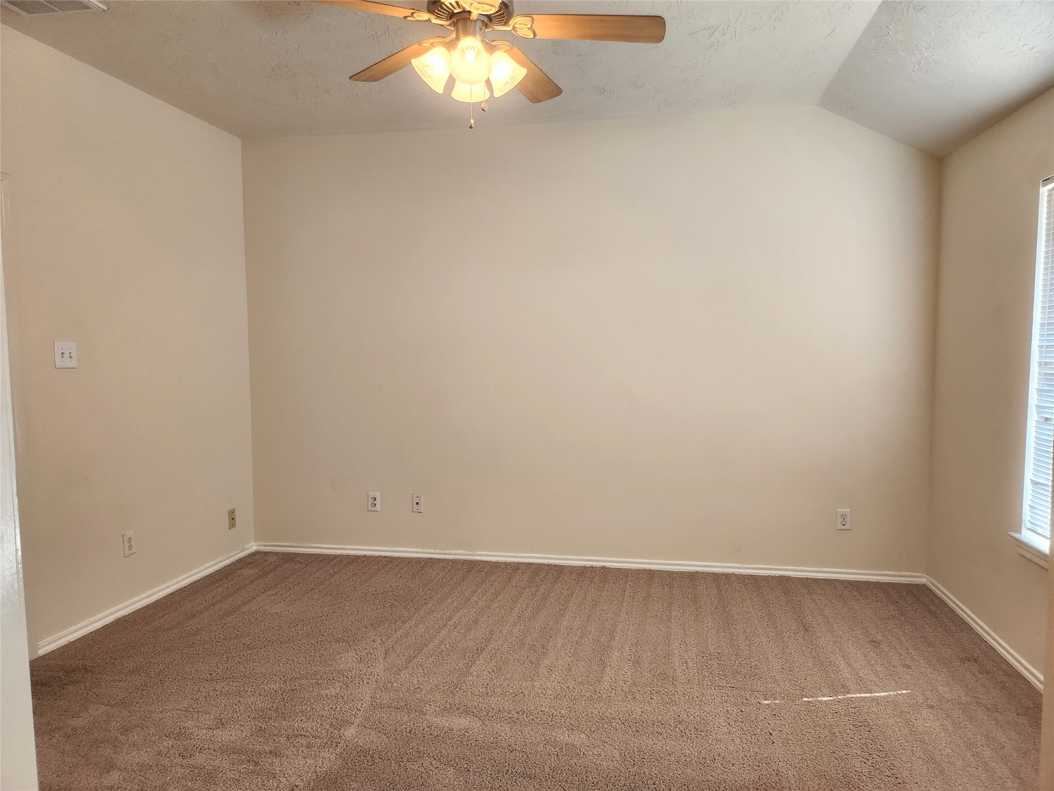 11509 Hackmatack Way Houston, TX 77066 - Photo 12 of 16 an empty room with a chandelier fan