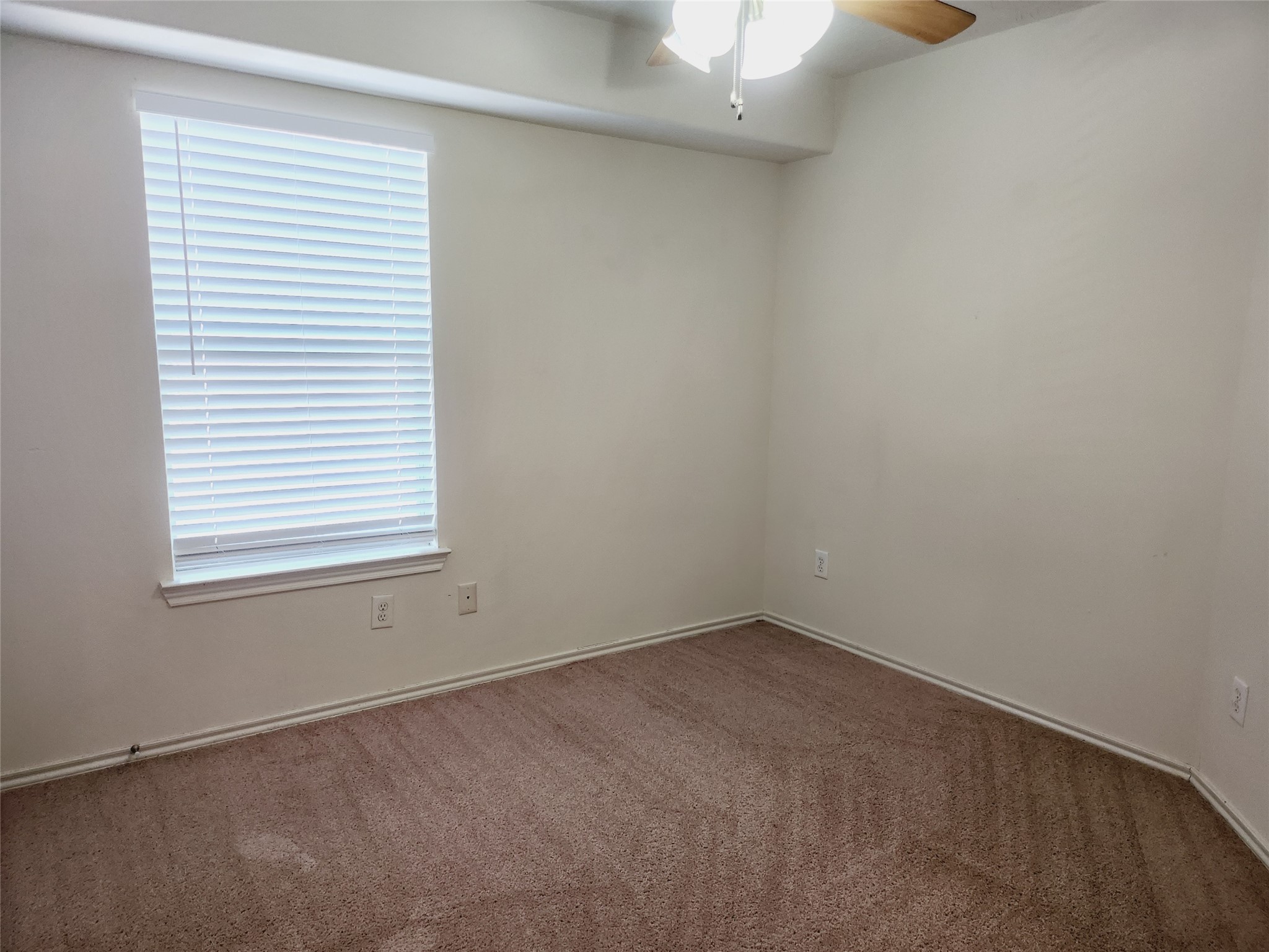11509 Hackmatack Way Houston, TX 77066 - Photo 14 of 16 an empty room with a window