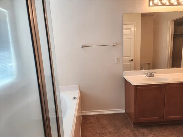 a bathroom with a sink a mirror and a toilet