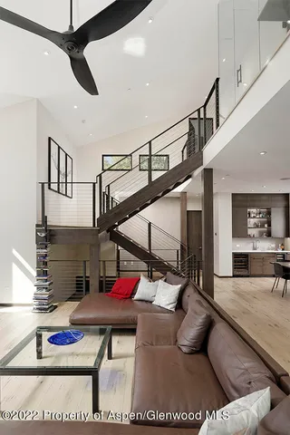 a large kitchen with a table and chairs in it
