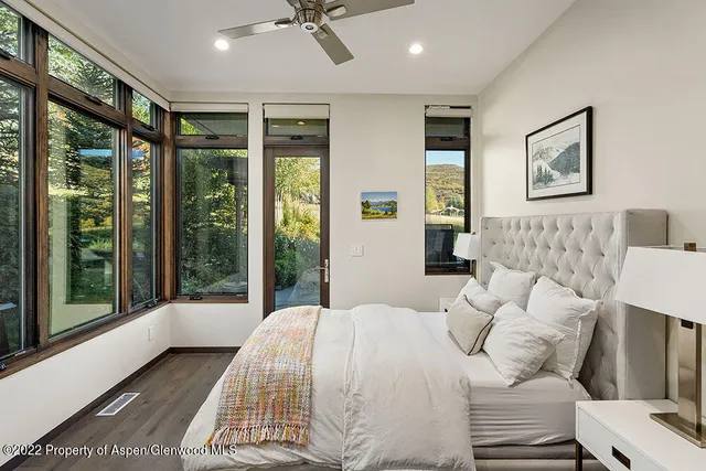 a view of a workspace with furniture and a potted plant