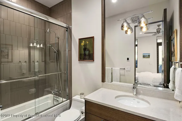 a bedroom with a large bed and a large window