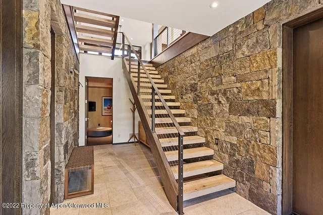 a bathroom with a tub sink shower and mirror