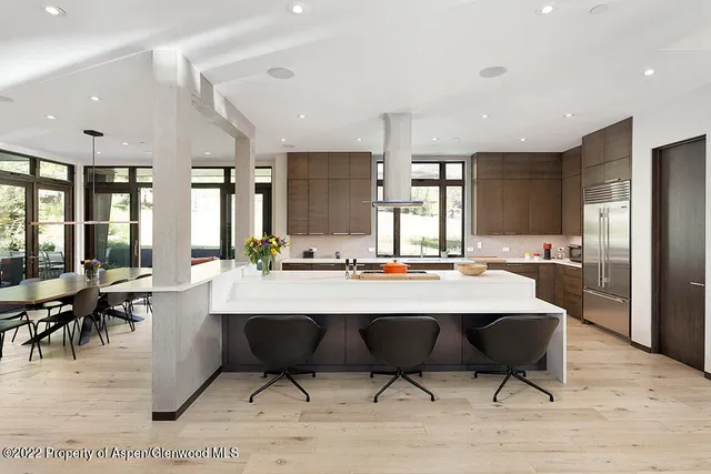 a living room with furniture fireplace and a window