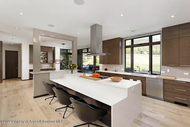 a sitting area with furniture on wooden deck
