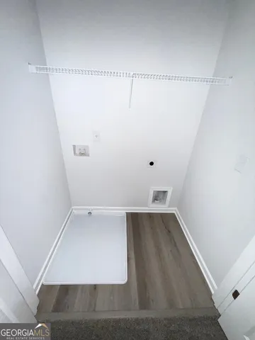 a view of walk in closet with clothes