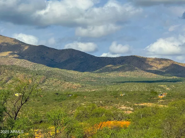 a view of an ocean and a mountain