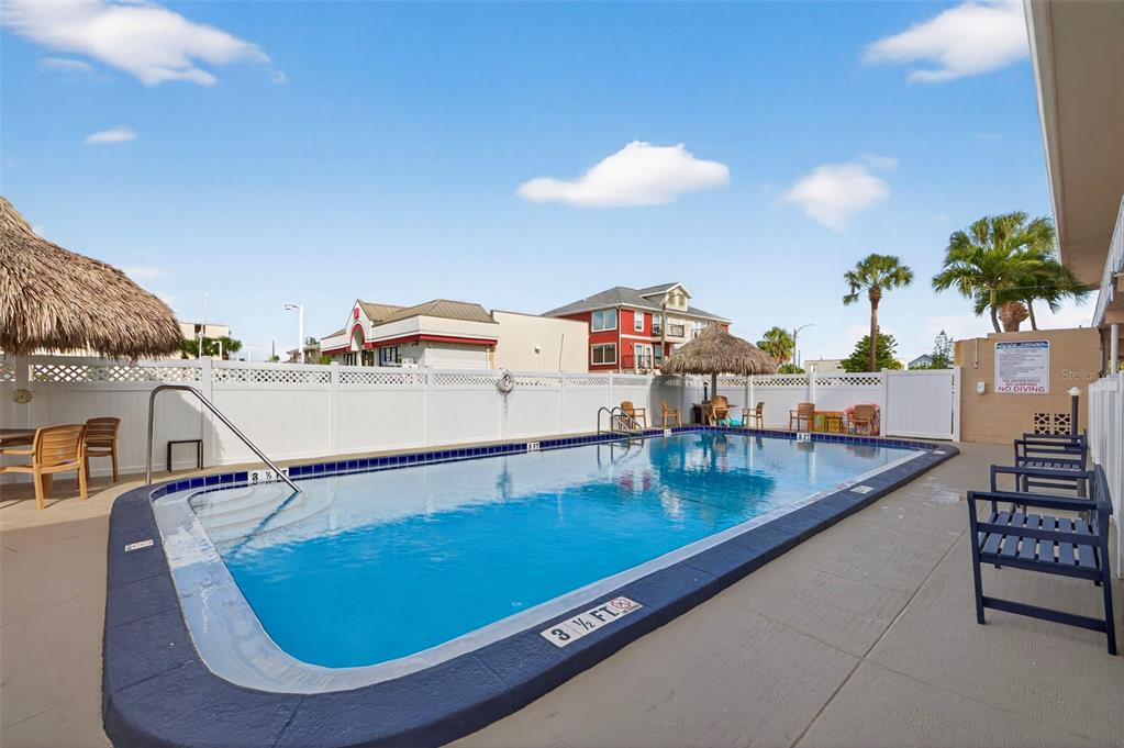 14251 Gulf Boulevard, Unit 5 Madeira Beach, FL 33708 - Photo 16 of 18 a room with furniture and a potted plant