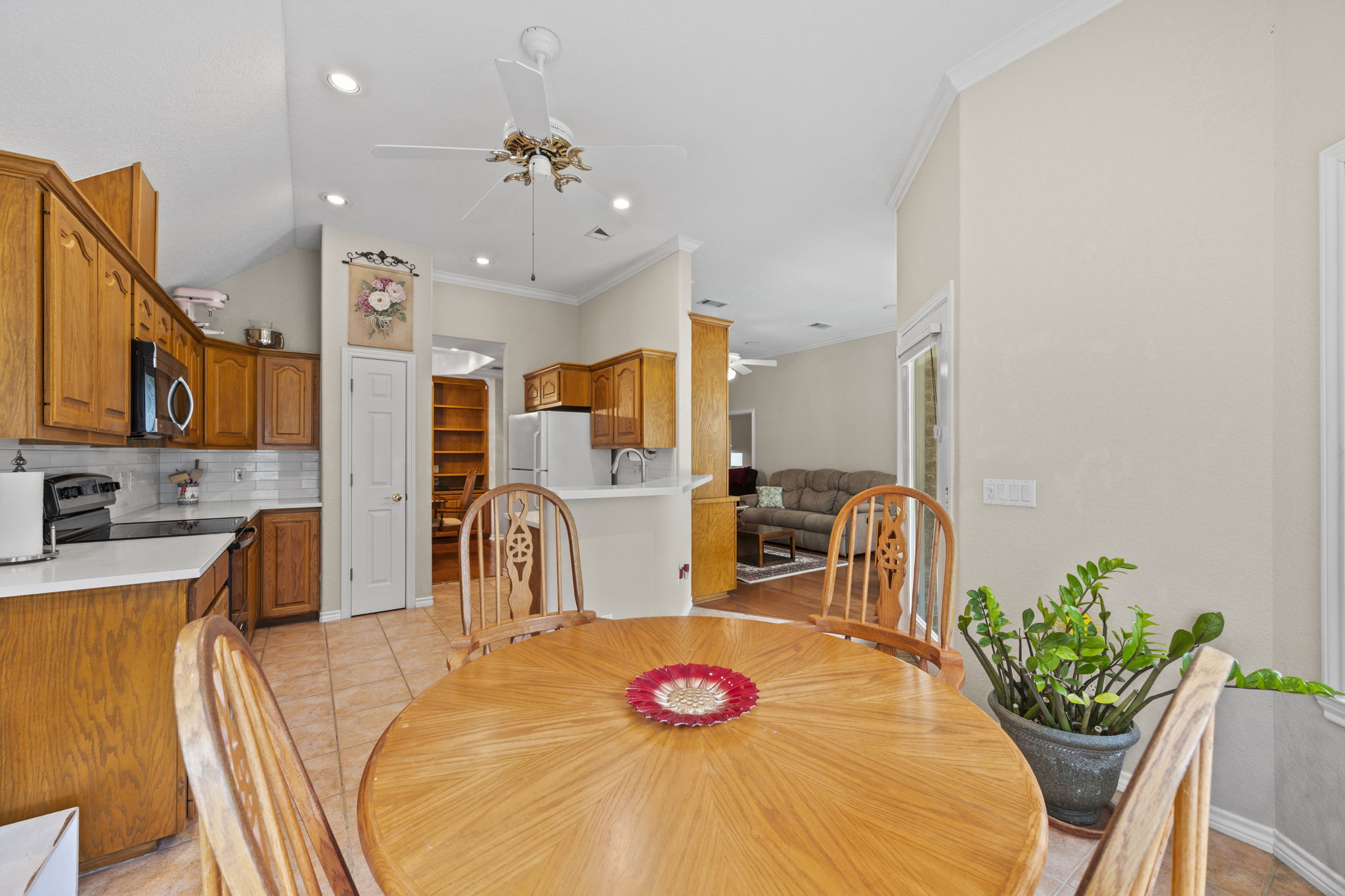 107 Stacey Cove Georgetown, TX 78628 - Photo 11 of 29 a very nice looking dining room with kitchen island furniture and a chandelier