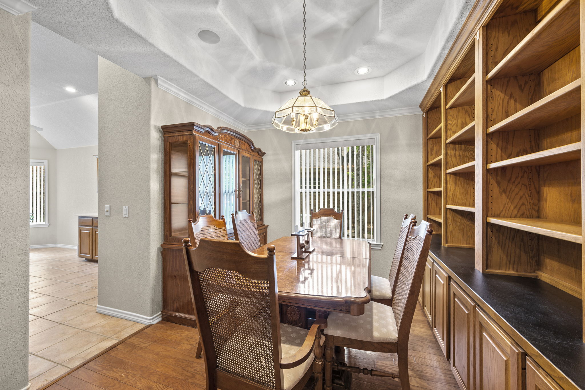 107 Stacey Cove Georgetown, TX 78628 - Photo 12 of 29 a view of a dining room with furniture and a chandelier