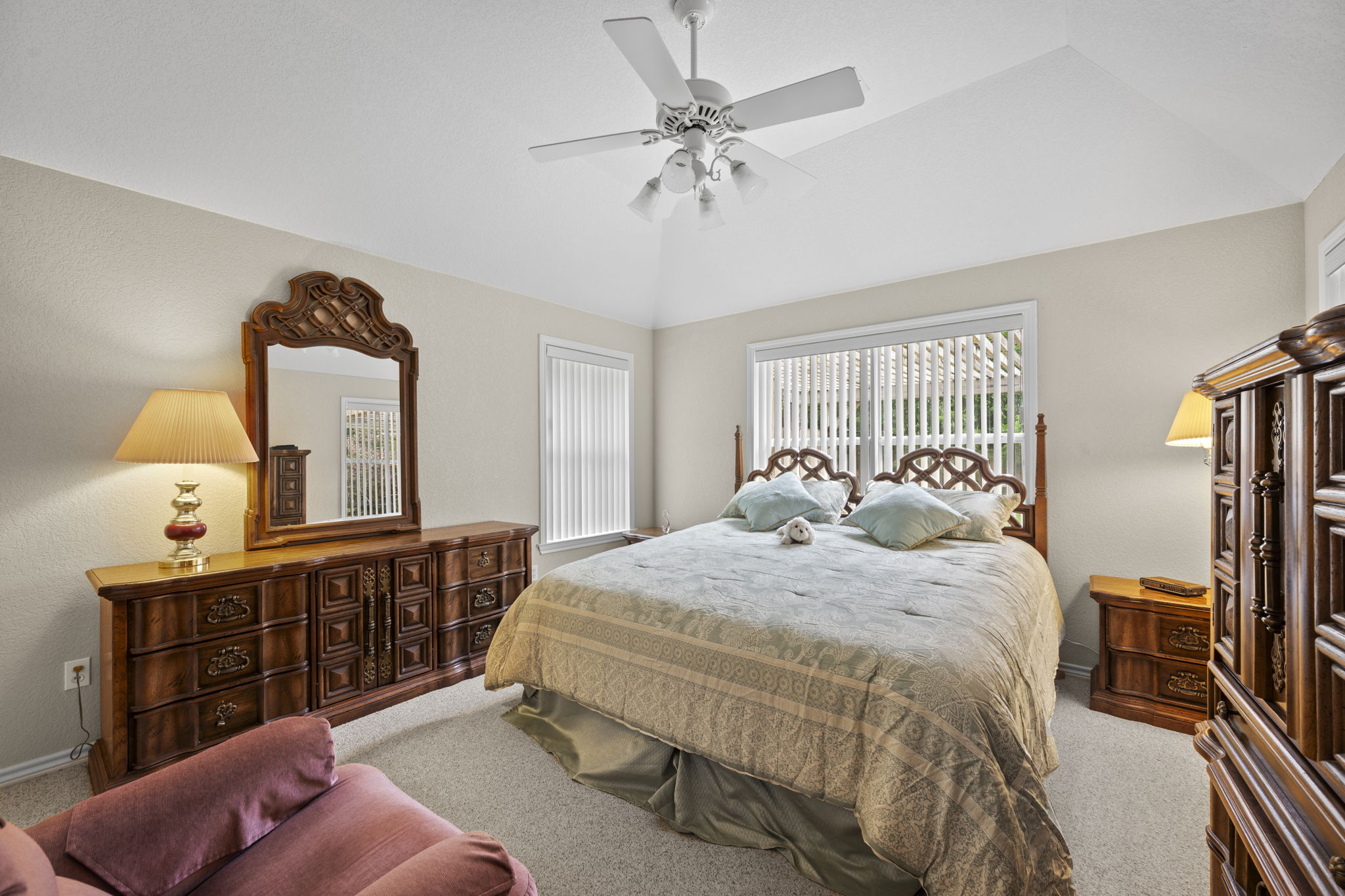 107 Stacey Cove Georgetown, TX 78628 - Photo 13 of 29 a bed room with a bed and a chandelier