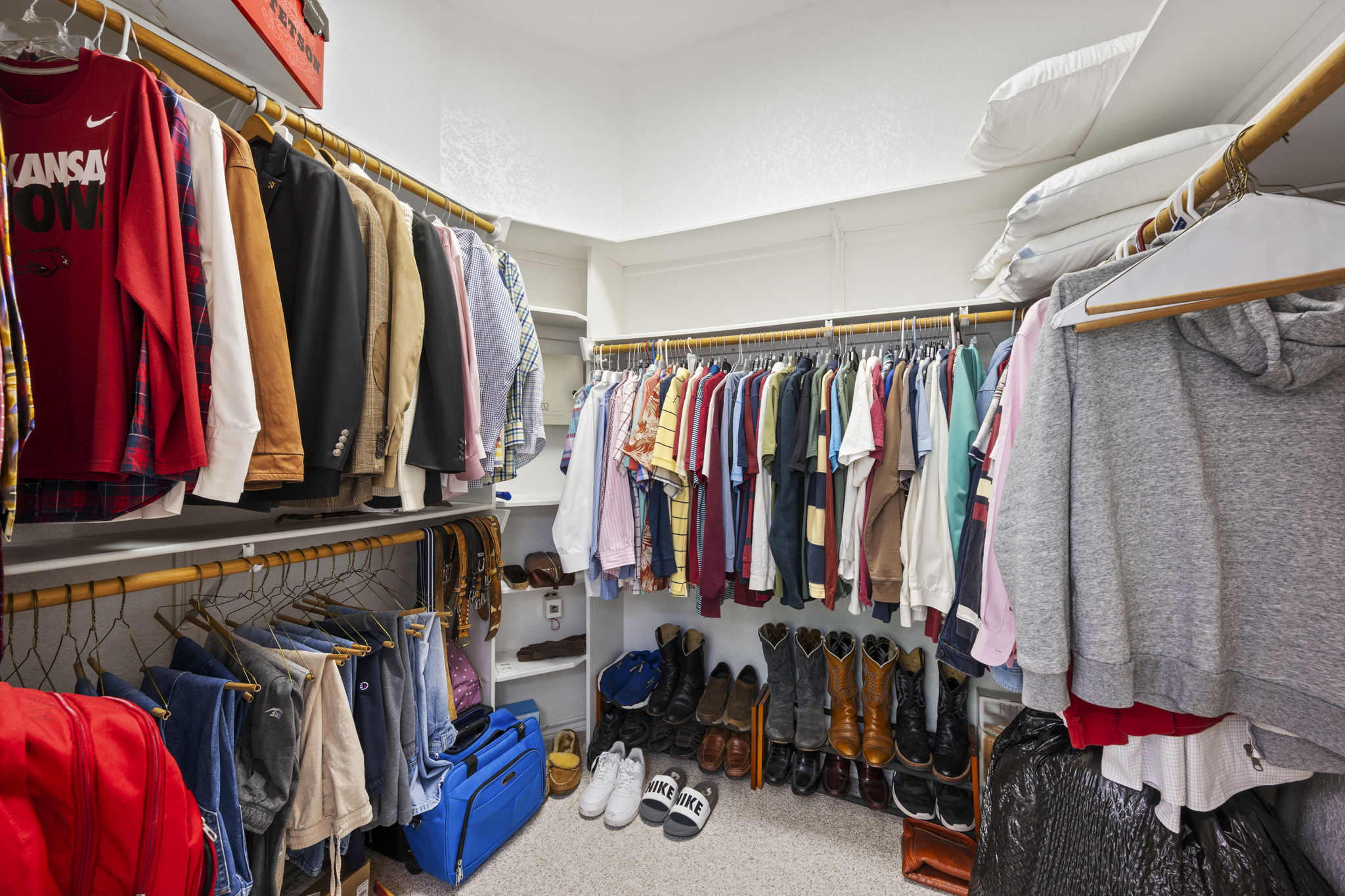 107 Stacey Cove Georgetown, TX 78628 - Photo 17 of 29 a view of walk in closet with clothes and shoes