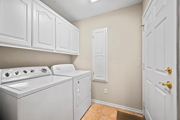 a view of storage and utility room with washer and dryer