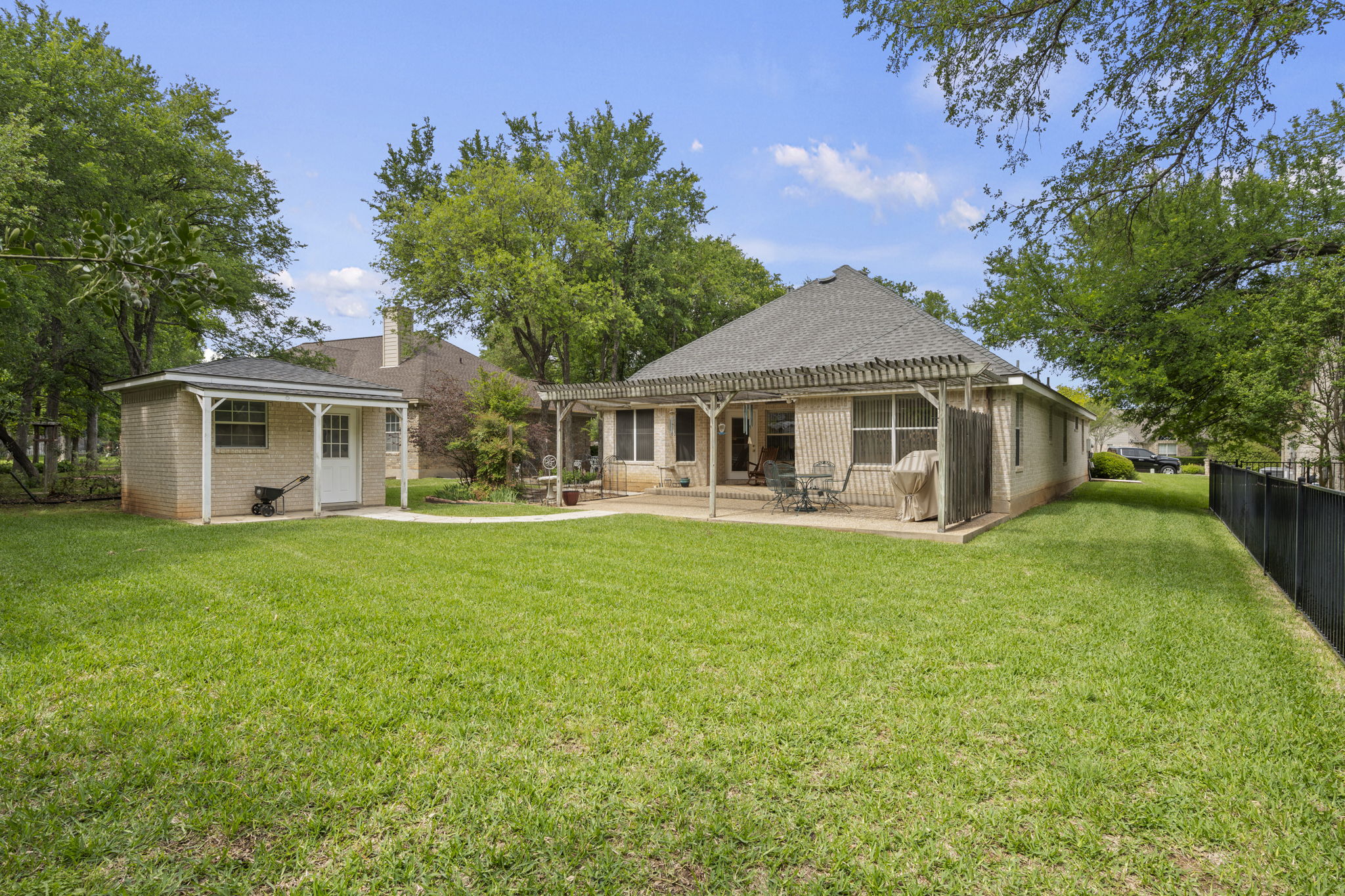 107 Stacey Cove Georgetown, TX 78628 - Photo 21 of 29 a front view of a house with a garden