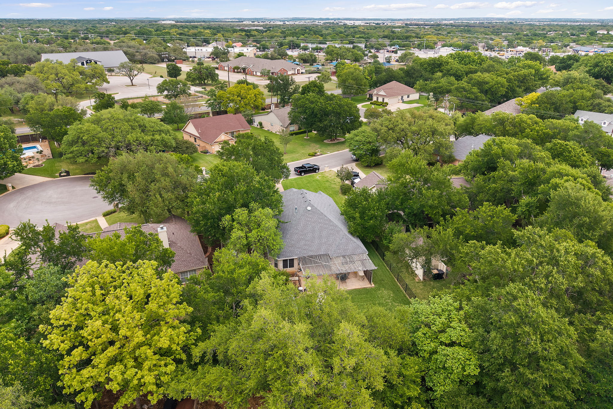 107 Stacey Cove Georgetown, TX 78628 - Photo 27 of 29 an aerial view of residential houses with outdoor space and trees