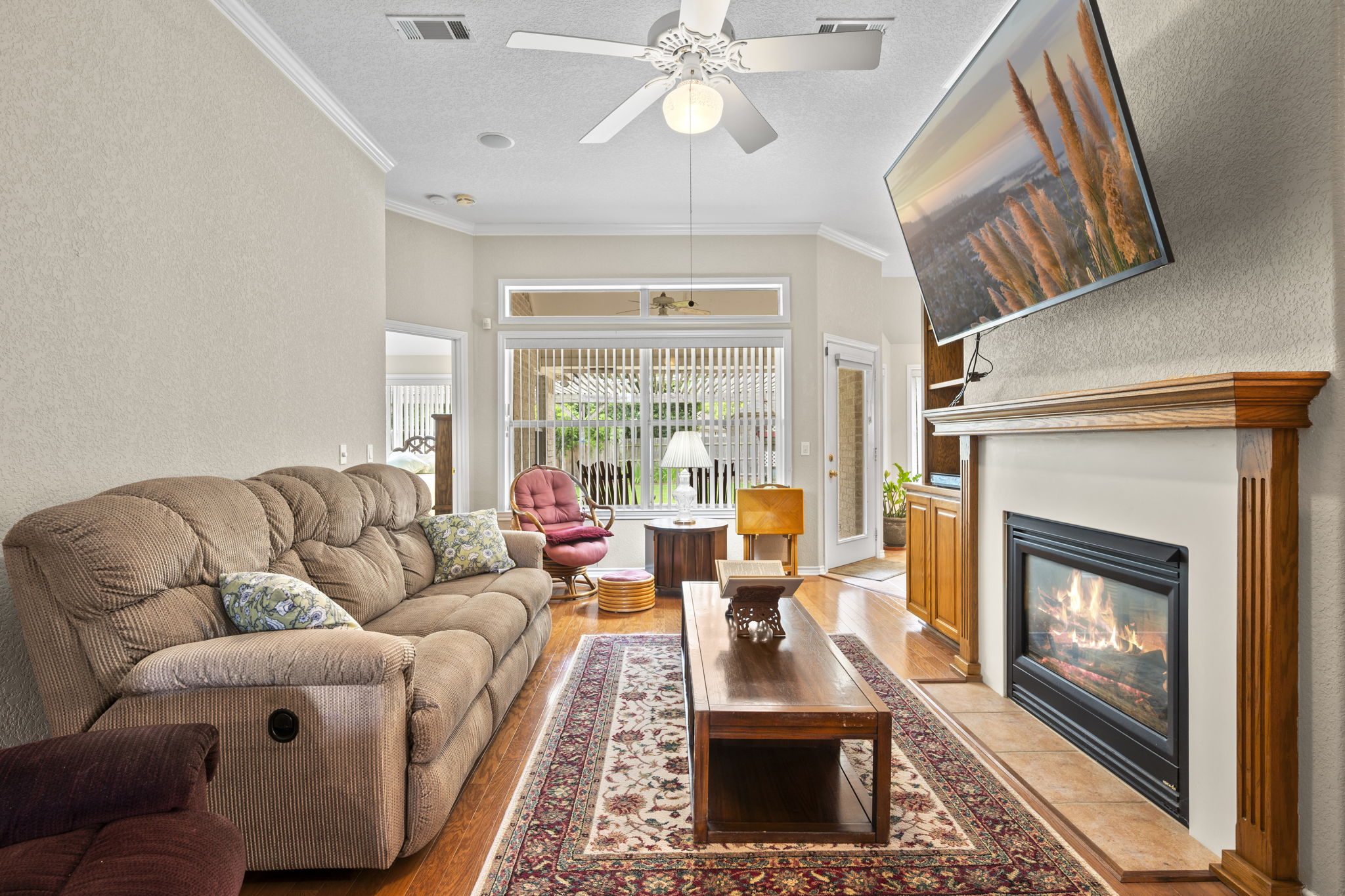 107 Stacey Cove Georgetown, TX 78628 - Photo 6 of 29 a living room with furniture large window and a fireplace