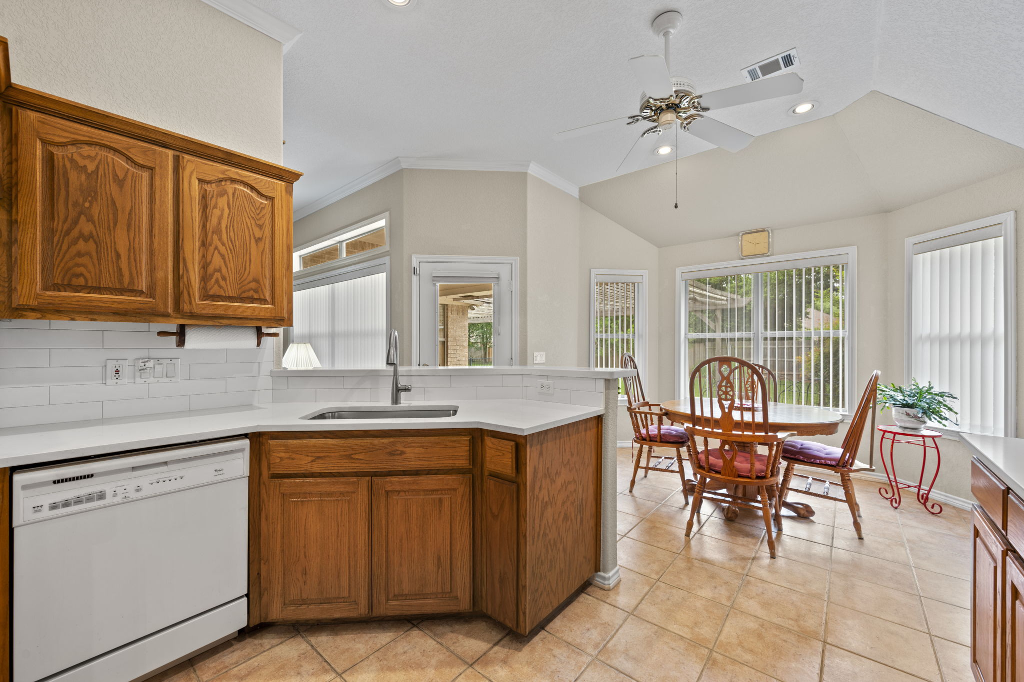 107 Stacey Cove Georgetown, TX 78628 - Photo 8 of 29 a open kitchen with granite countertop a sink cabinets and dining table
