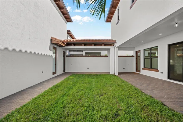 a view of outdoor space with palm trees