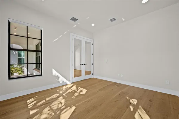 a large kitchen with kitchen island a sink stainless steel appliances and cabinets