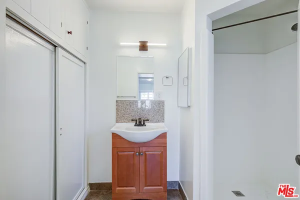 a bathroom with a sink and a mirror