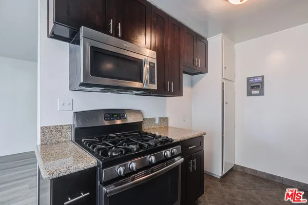 a kitchen with a stove and a microwave
