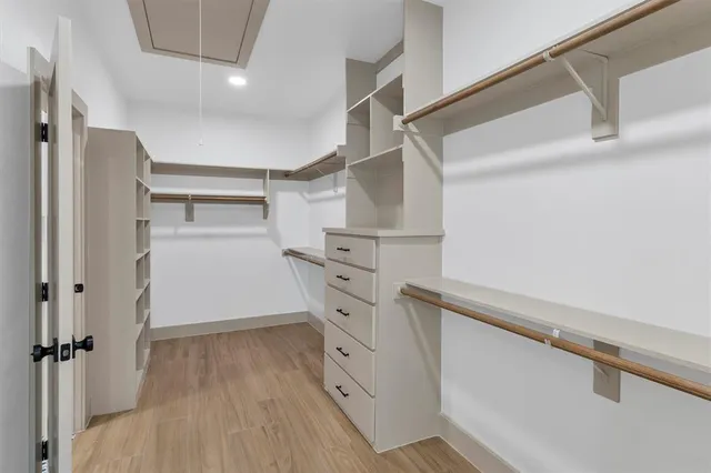 a spacious bathroom with a bathtub and sink