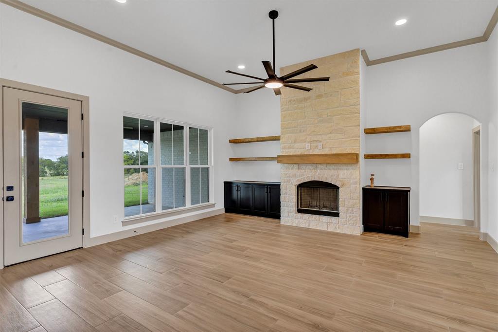5006 Stover Way Granbury, TX 76049 - Photo 17 of 40 a view of a livingroom with a fireplace and window