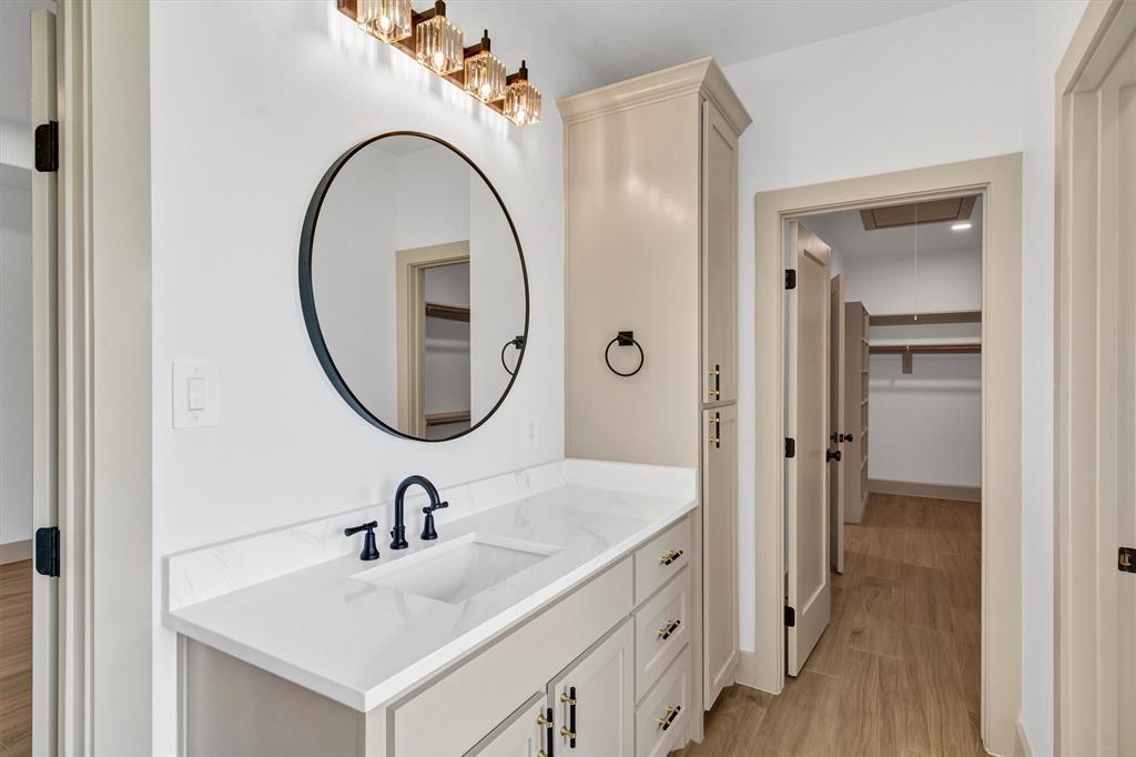 5006 Stover Way Granbury, TX 76049 - Photo 28 of 40 a bathroom with a sink and a mirror